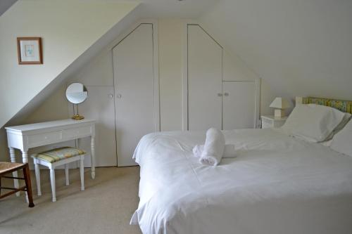 Ένα ή περισσότερα κρεβάτια σε δωμάτιο στο Cardross Holiday Cottages