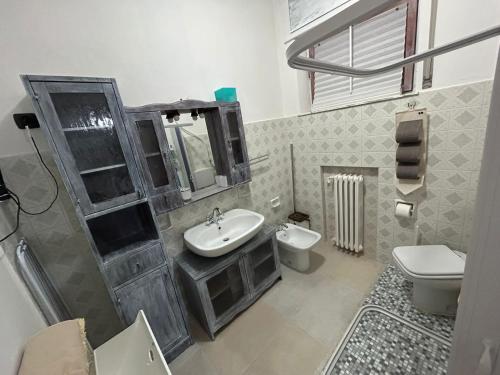 a bathroom with a sink and a toilet at Casa Giulia in Porto SantʼElpidio