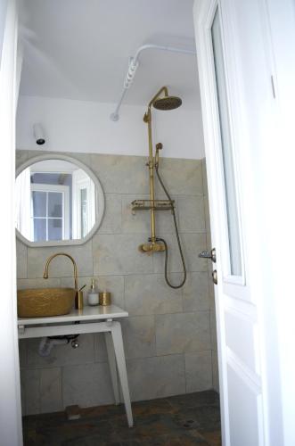a bathroom with a sink and a mirror at CASA Apusul Soarelui in Eforie Nord