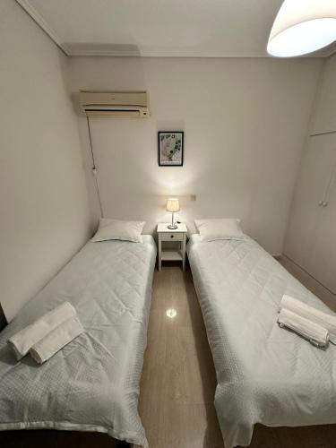 Ένα ή περισσότερα κρεβάτια σε δωμάτιο στο Aegean Hill Retreat