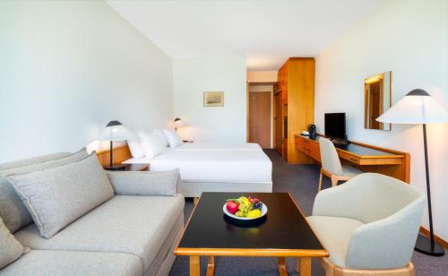 Кровать или кровати в номере Hotel Club Tihany