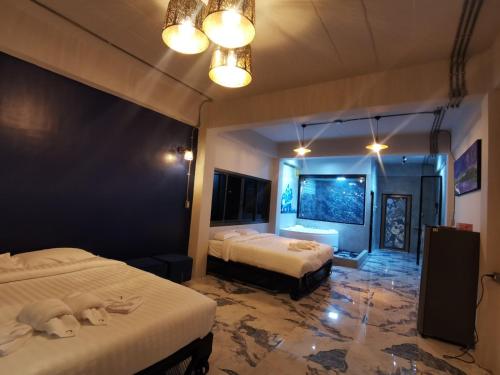 Postel nebo postele na pokoji v ubytování MonkeyArt Hotel&Cafe