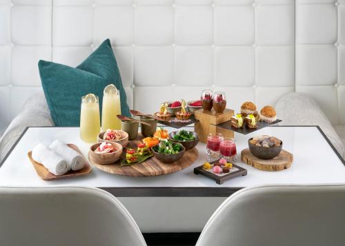 a tray of food on top of a table at COMO The Halkin in London