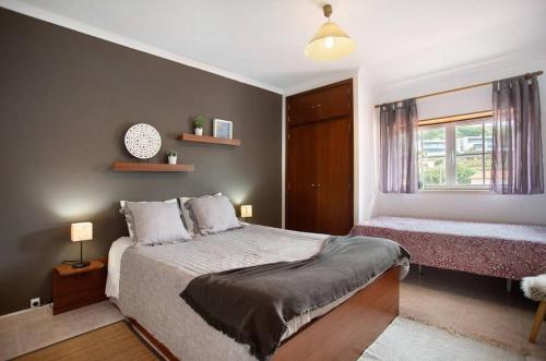 Ένα ή περισσότερα κρεβάτια σε δωμάτιο στο Porto Dinheiro Beach II