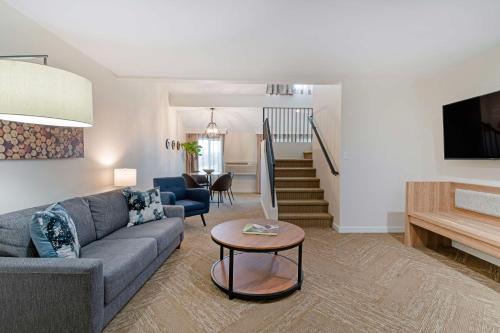 a living room with a couch and a table at Best Western Plus Inn at the Vines in Napa