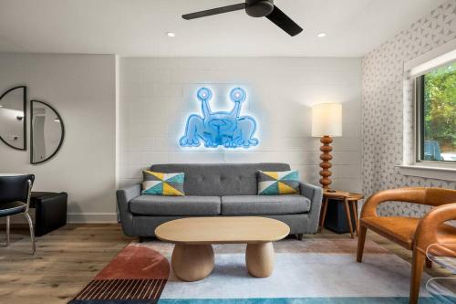 a living room with a couch and a table at SoCo-a-Go-Go in Austin