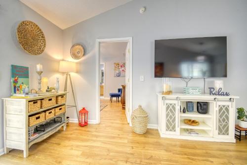 a living room with a television on a wall at SUMMER Vacation Getaway Pets Welcome Remodeled in Myrtle Beach