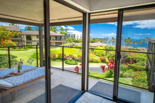 a view from the porch of a home with a view of the ocean at Elua 406 in Wailea
