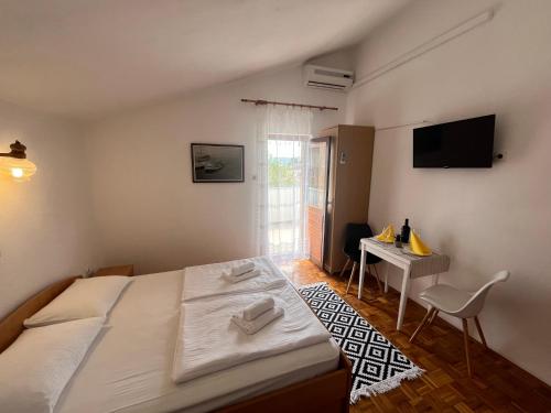 Katil atau katil-katil dalam bilik di Apartmani palma