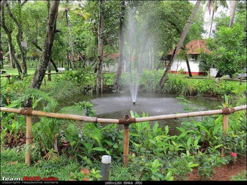 a fountain in a pond in a garden at Abad Turtle Beach in Mararikulam