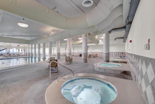 a hot tub in the middle of a building at The Oasis At Orange Beach 2215 by Liquid Life in Orange Beach