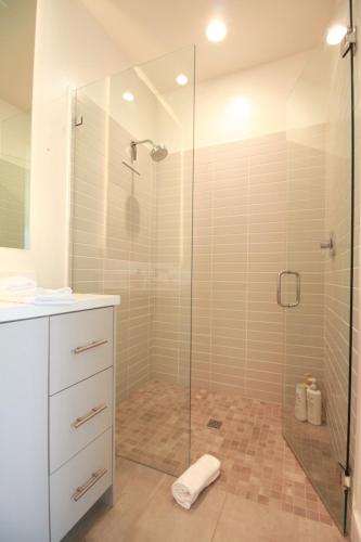 a bathroom with a shower with a glass door at Best Spot in Indian Wells. Walk to Tennis Gardens in Indian Wells