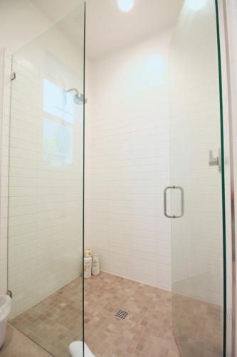 a shower with a glass door in a bathroom at Best Spot in Indian Wells. Walk to Tennis Gardens in Indian Wells