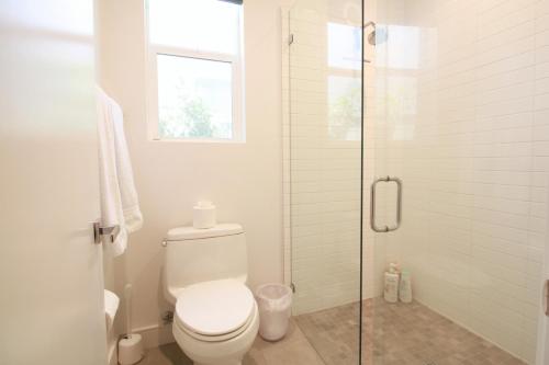 a bathroom with a toilet and a glass shower at Best Spot in Indian Wells. Walk to Tennis Gardens in Indian Wells