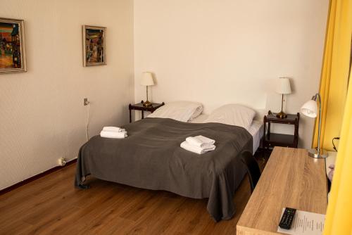 Postel nebo postele na pokoji v ubytování Hotel Hundested
