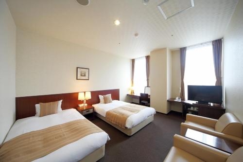 Katil atau katil-katil dalam bilik di Asahikawa Toyo Hotel