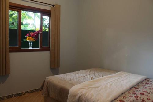 Postel nebo postele na pokoji v ubytování Casa da Rua do Coreto do Capão