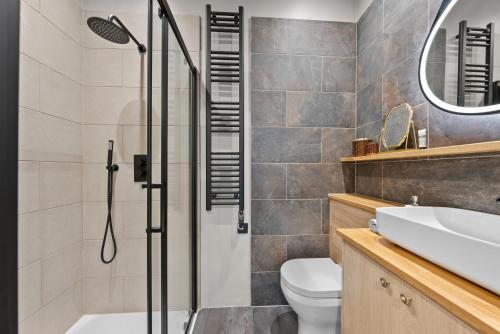 a bathroom with a shower and a toilet and a sink at VICHY - The Hampstead Star | Prime Location in London