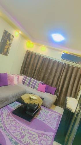 a living room with a couch and a table at كورنيش النيل in Cairo