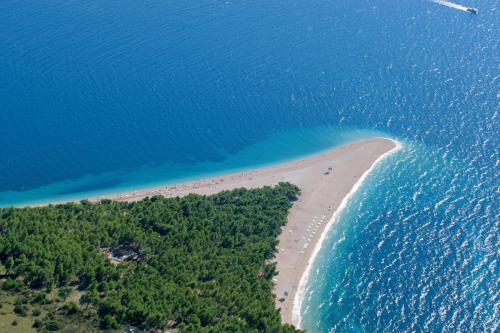 an aerial view of a beach and the ocean at She House - built for pleasure - Island of Brač in Gornji Humac