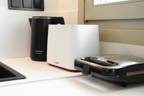 a cell phone sitting on a counter next to a box at Apademia Skyros Luxury Residences in Skiros