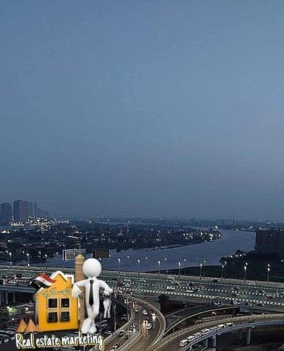 a view of a city with a large inflatableiety at كورنيش النيل in Cairo