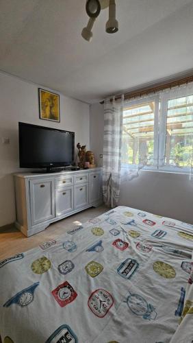 Posteľ alebo postele v izbe v ubytovaní Domek na jeziorem
