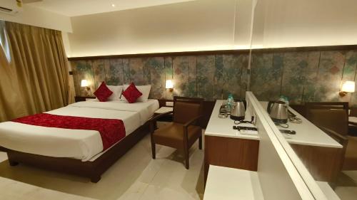Hotel Prestige Residencyにあるベッド