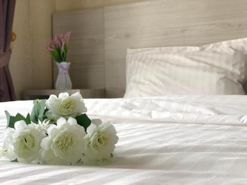 Ένα ή περισσότερα κρεβάτια σε δωμάτιο στο TheTra Homestay
