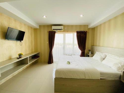Ένα ή περισσότερα κρεβάτια σε δωμάτιο στο TheTra Homestay