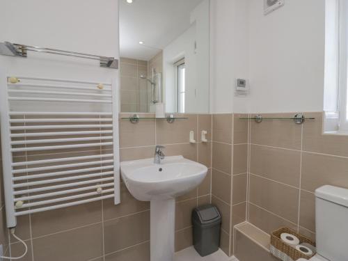 a bathroom with a sink and a toilet at Ingle View in Carnforth