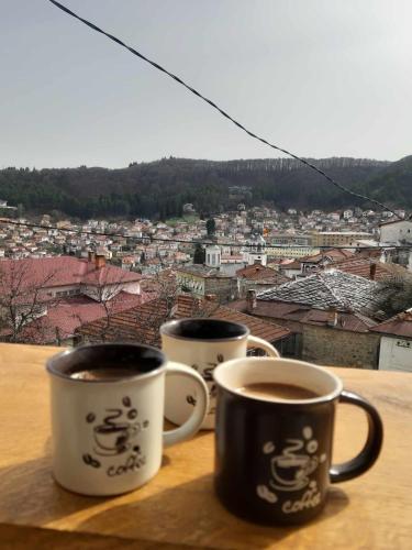 two cups of coffee sitting on top of a table at Villa Irena in Kruševo