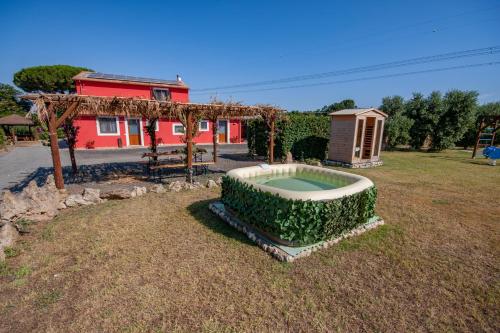 a house with a pool in the yard at Agriturismo L'Istrice di Giò in Montalto di Castro