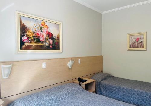 Dona Adelia Hotel e Restauranteにあるベッド