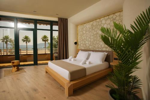 Postel nebo postele na pokoji v ubytování Hotel Brooklyn Vlore