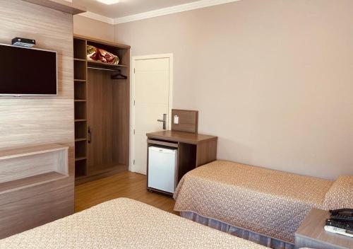 Dona Adelia Hotel e Restauranteにあるベッド