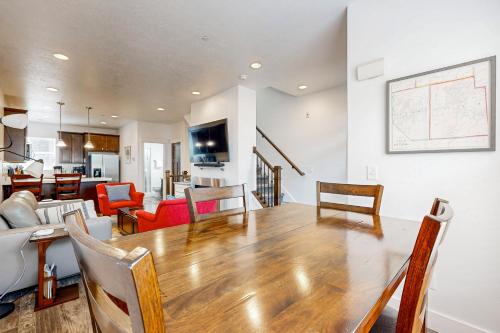 a living room with a wooden table and chairs at Nevis at Newpark Unit 4 in Park City