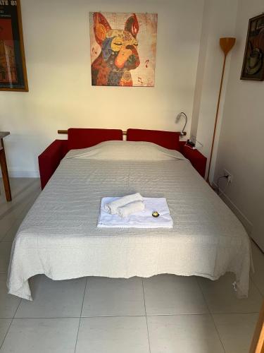 a bedroom with a bed with a towel on it at mineVaganti in Ancona