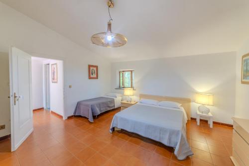 a bedroom with two beds in a room at Il Borgo nel bosco in Canterano