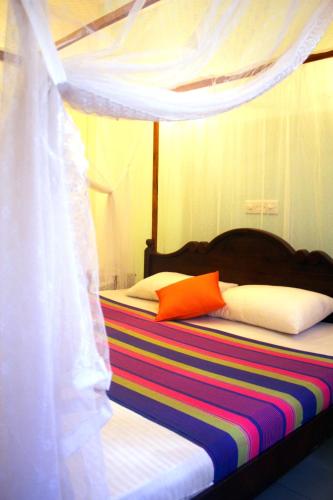 Ein Bett oder Betten in einem Zimmer der Unterkunft Tiny Royal Palace