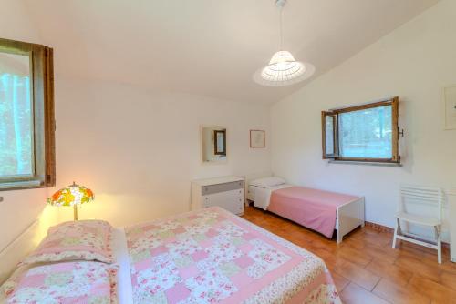 a bedroom with two beds and a desk and a table at Il Borgo nel bosco in Canterano