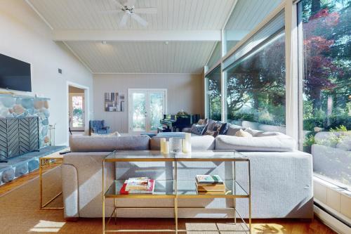 a living room with a couch and a table at Stones Way in Lake Forest Park