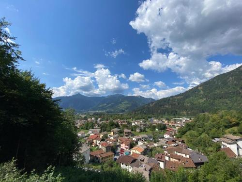 a town in a valley with mountains in the background at A cjase di Luca in Paluzza