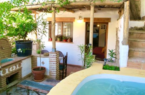 a house with a swimming pool in a yard at El Encanto in Monachil