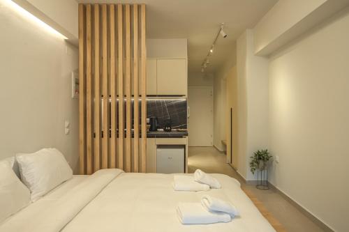 Ένα ή περισσότερα κρεβάτια σε δωμάτιο στο Mini Suites Trikala