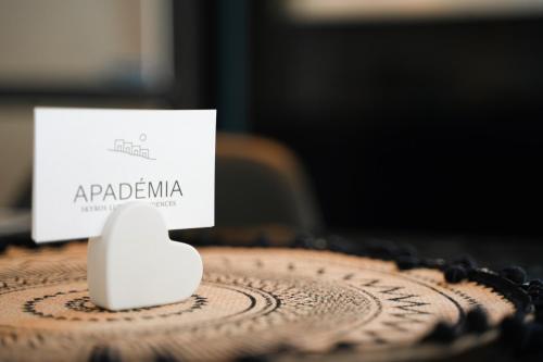 a white object sitting on top of a wooden table at Apademia Skyros Luxury Residences in Skiros