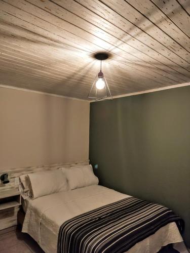 Letto o letti in una camera di Oliva Hostería y Apart
