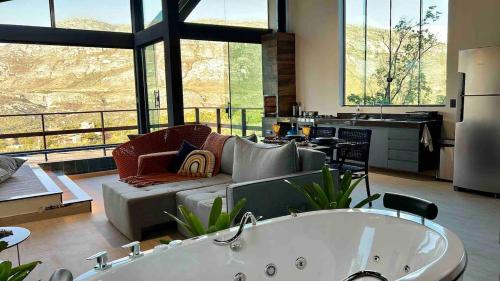 Een zitgedeelte bij Casa 422 - Loft Bromélia