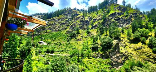 a view from a balcony of a mountain with trees at Laida Holiday Homestay in Banjār
