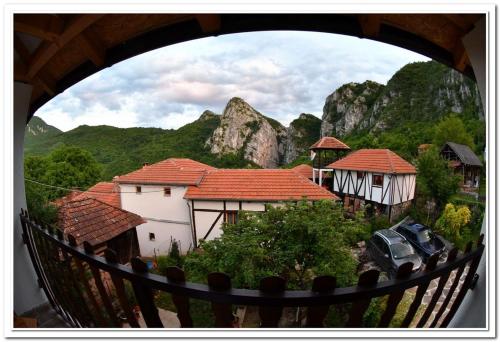a view of a group of houses with mountains in the background at Golemi kamik Pirot Vlasi 4 in Pirot